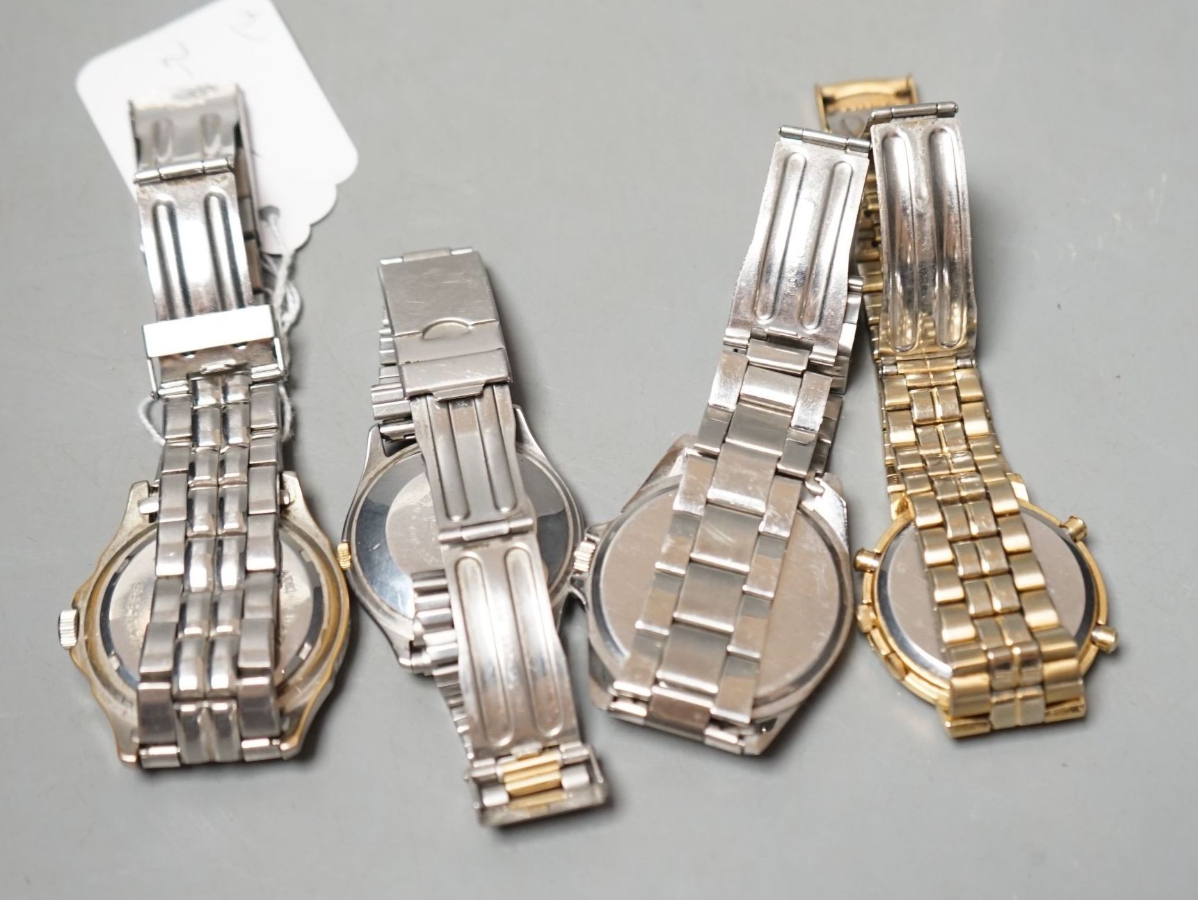 Four assorted gentleman's modern wrist watches, including Seiko and Tissot.